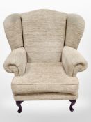 A contemporary wingback armchair