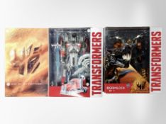 Two Hasbro Transformers figures, Grimlock and Platinum edition Silver Knight Optimus Prime,