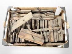 A collection of antique woodworking planes.