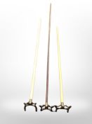 A group of billiards cue rests.