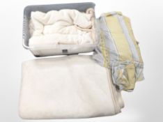 Two boxes of throws and bedding.