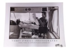 A vintage Terry O'Neill poster of Clint Eastwood reading a newspaper during filming of 'Joe Kidd',