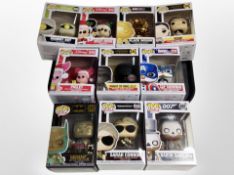 A group of Funko Pop! figures including Terminator, Batman, Disney, etc.