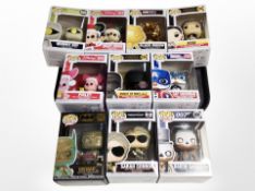 A group of Funko Pop! figures including Terminator, Batman, Disney, etc.