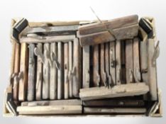 A collection of antique woodworking planes.