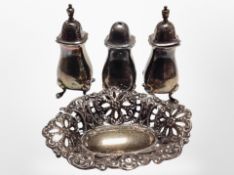A pierced silver dish and three condiments. CONDITION REPORT: 106g gross.