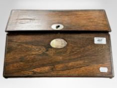 A Victorian rosewood and mother of pearl inlaid writing slope containing inkwells,