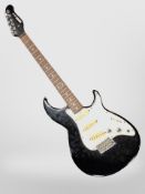 A Yamaha SE300 electric guitar.