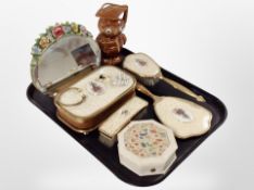 A group of dressing table brushes, together with a pottery money box in the form of an owl,