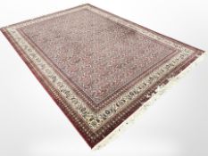 A machine-made carpet of Persian design,