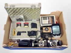 A box of cameras including Pentax Auto 1110, Poloroid,