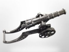 A cast-iron model of a cannon, length 44cm.