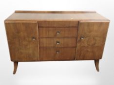 A mid 20th century walnut sideboard,