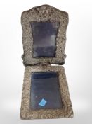 Two antique embossed silver-mounted photograph frames. largest 22cm high.
