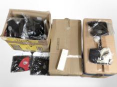 Two boxes containing a quantity of new fabric face masks, and a further box containing shaving kits.