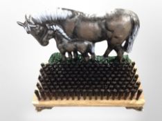 A cast-iron horse and foal boot scraper, width 28cm.
