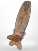 An African carved hardwood birthing chair