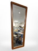 A 1970's teak framed mirror,
