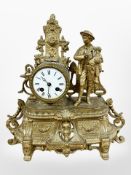 A 19th century French gilt metal figural mantel clock, striking on a bell, with pendulum and key,