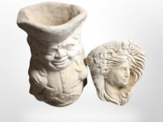 A concrete Toby jug planter,