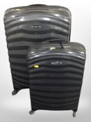 Two Samsonite luggage cases.