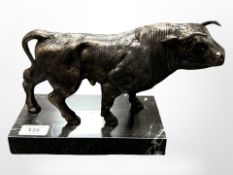 A cast-iron bowl on marble plinth, length 29cm.