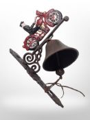 A cast-iron motorbike wall-mounted bell on bracket, length from wall 26cm.