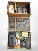Three boxes containing tap and die pieces.