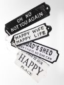 Four painted cast-iron plaques, 'Happy wife, happy life', etc., longest 20cm.