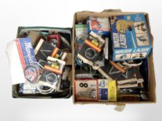 Two boxes of assorted bike parts.