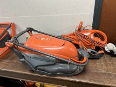 A Flymo lawn mower and a leaf blower