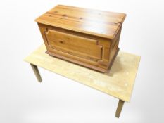 A contemporary rectangular coffee table and a pine blanket box