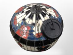 A large Tiffany style pendant light shade,