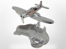 A cast-aluminium plane with dish beneath, width 17cm.
