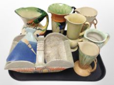 A group of Art Deco ceramic vases, jugs, and a basket including Wade, Czechoslovakian, etc.
