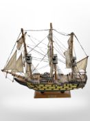 A model of HMS Victory on plinth, height 44cm.