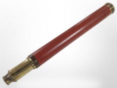 A brass and lacquered wood telescope signed 'Dollond, London, Day or Night'.