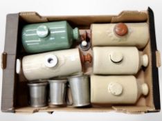 Five antique stoneware hot water bottles and three pewter tankards