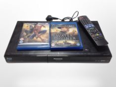 A Panasonic Blu Ray disc player with remote and two Blu Ray movies