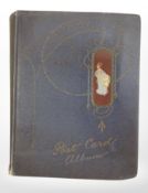 A large quantity of assorted postcards in one album.