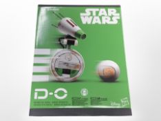 A Hasbro Disney Star Wars D-O interactive Blu-tooth Droid in box