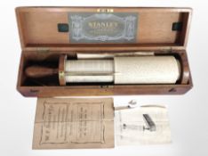 A Stanley Fuller calculating slide rule in pine box with instructions.