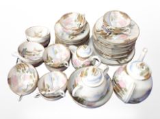 Forty four pieces of Japanese export eggshell tea china