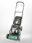 A Qualcast petrol lawn mower