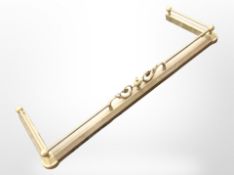 A Victorian brass fender.