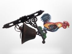 A cast-iron cockerel bell on bracket, length from wall 23cm.