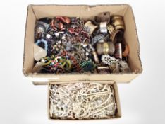 Two boxes containing a large quantity of costume necklaces, faux pearls, bracelets, bangles, etc.