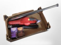 An Einhell garden leaf blower, a 32-inch baseball bat, and two boxed Typo sunset projection lamps.