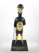 A cast-iron Guinness money bank, height 35cm.