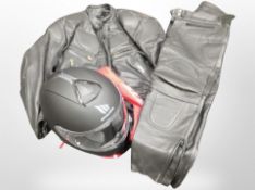 An MT Helmets motor cycle helmet and a black leather jacket with trousers